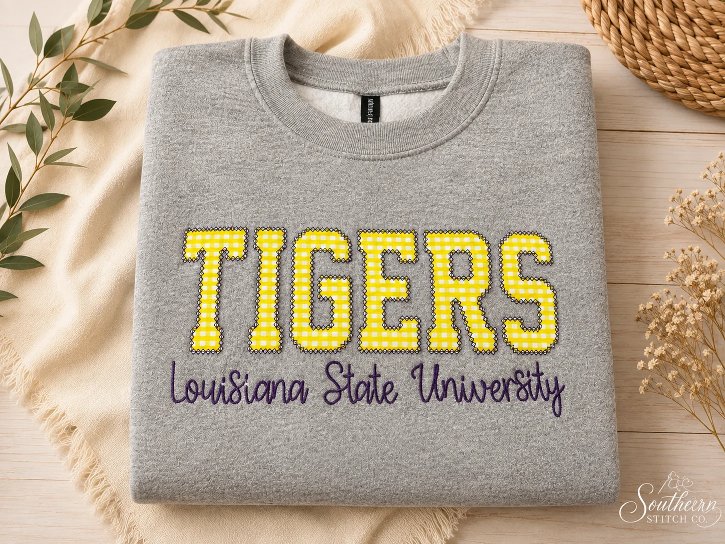 Gray LSU Tigers sweatshirt with yellow gingham appliqué.