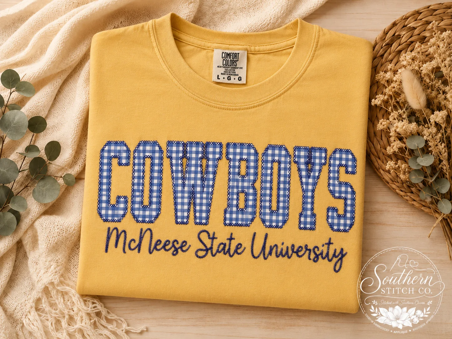 Mustard Comfort Colors Cowboys T-shirt in diamond stitch with blue gingham letters.